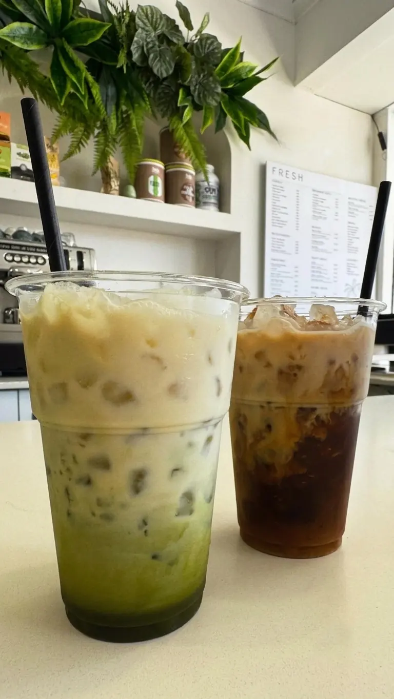 Iced matcha and iced coffee with milk to go on the Fresh Ibiza counter